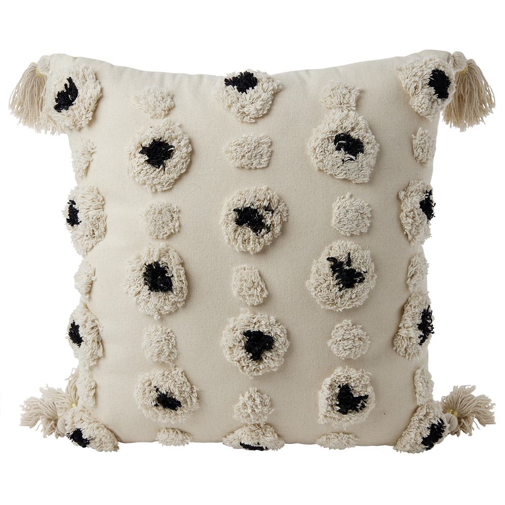 Beige and black tufted decorative cushion with pompoms