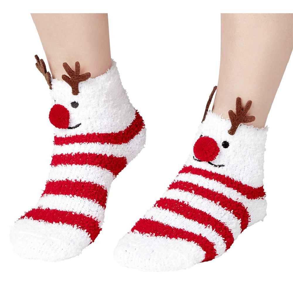 Box of cozy knitted socks with a red striped reindeer motif