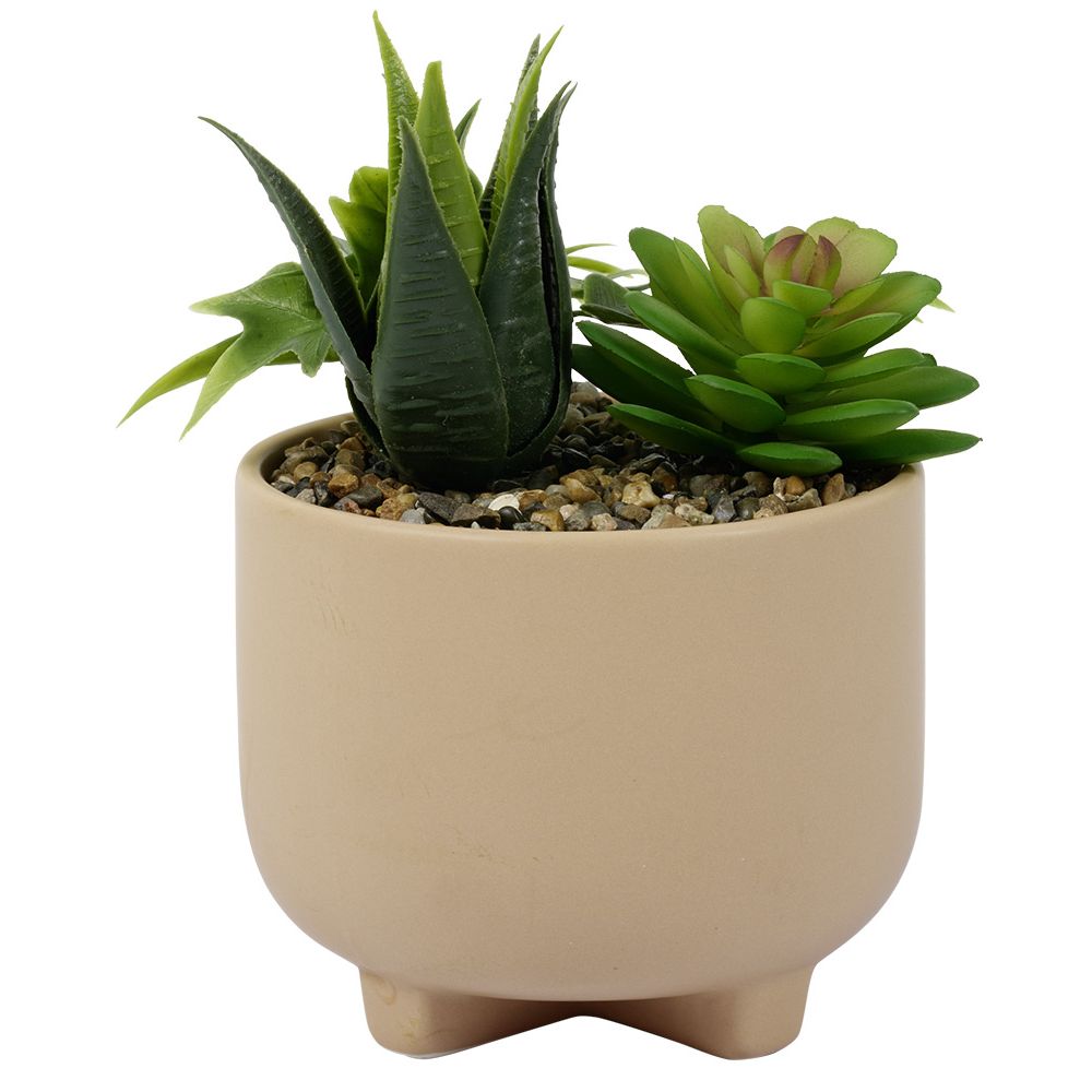 Artificial plant in beige ceramic pot