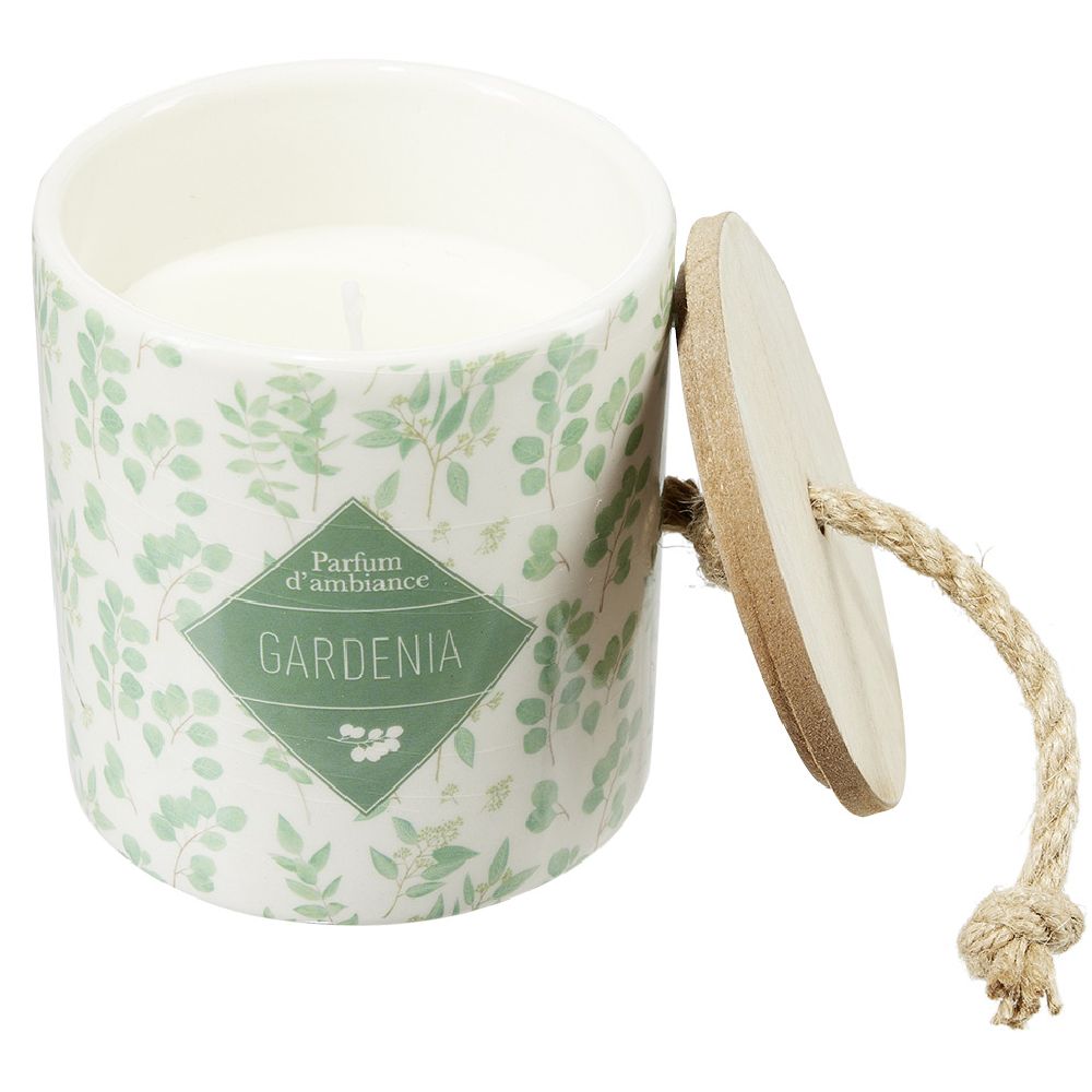 Candle in a ceramic pot with a plant design
